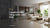 Bright modern open-plan home with large beige marble-look floor tiles