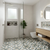 Modern bathroom with patterned tiles, wooden vanity, and plant decor with green  color printed tile