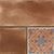6004 Decor Vitrified Tile 20x20 Inch – Warm brown tile featuring a mix of plain and embossed floral patterns, perfect for rustic or Mediterranean-style spaces.