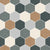 Outdoor patio flooring with hexagonal Moroccan vitrified tiles in a repeating pattern of beige, white, and dark gray, styled with a wooden dining table, rattan chairs, and lush greenery.