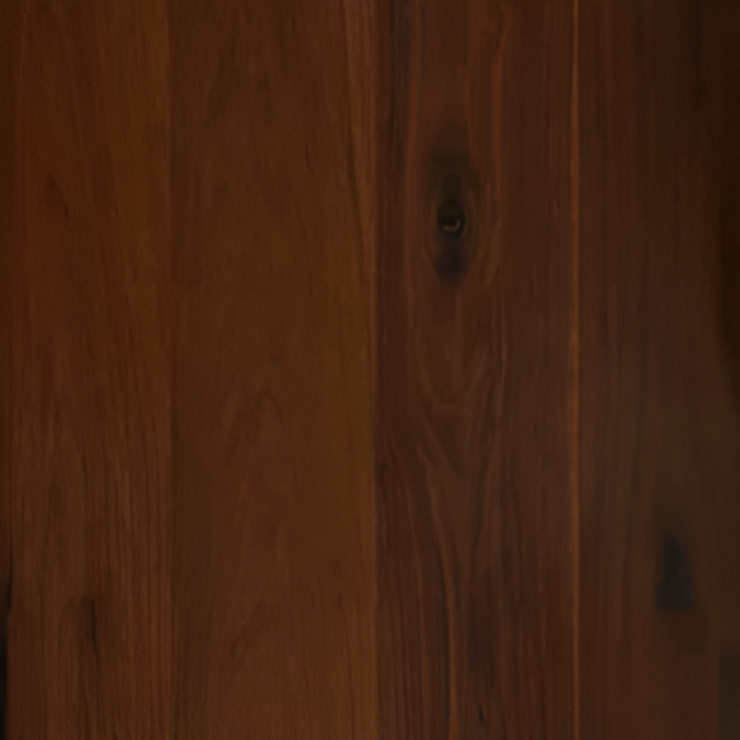 American Walnut Dark Engineered Flooring 7x75 Inch, showcasing rich dark brown tones with natural walnut grain patterns and a smooth, durable finish for elegant interiors.
