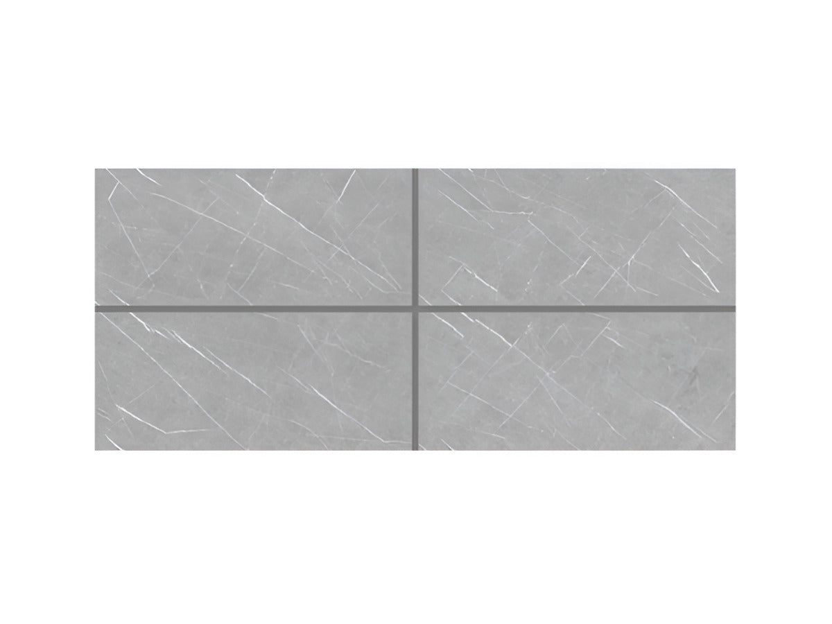 Arina Grey vitrified tile in 24x48 inch large format with a glossy marble-inspired surface, installed on both floor and wall, showing seamless alignment, smooth reflective finish, modern interior styling, and premium architectural look.