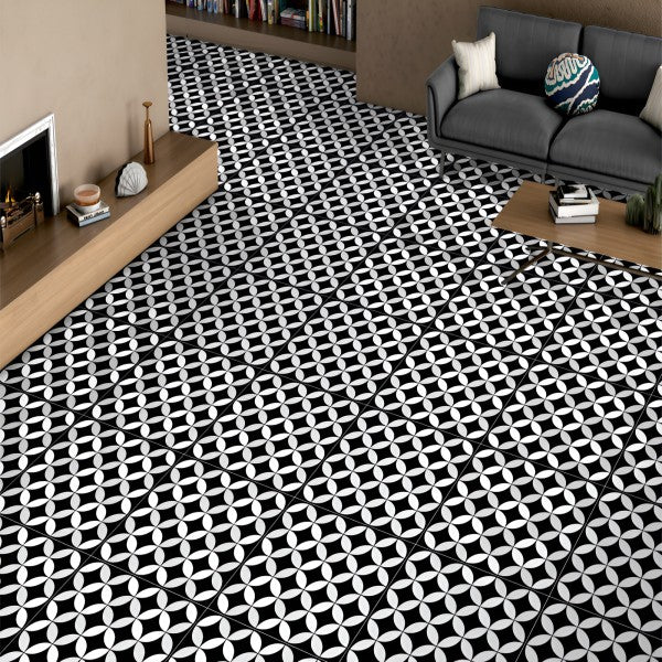 Top view of Geometrical Black Moroccan Matt 24x24 inch floor tiles arranged in a seamless pattern featuring bold black background with overlapping white petal-shaped geometric designs, giving a modern and stylish look.