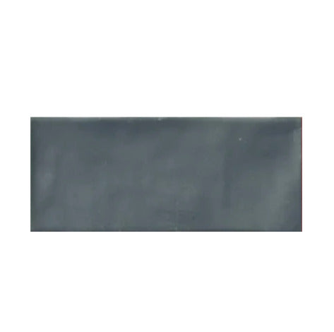 Cleo Fossil Glossy Subway Tile 3x12 inch with a glossy finish, featuring a soft beige-grey fossil-inspired surface, smooth and durable, ideal for modern backsplashes and decorative wall applications.
