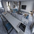 Premium quartz kitchen counter top and table top slab with smooth gloss finish installed in a modern modular kitchen interior featuring seamless surface design, polished texture, spacious countertop application, elegant engineered stone detailing, and large-format slab suitable for residential and commercial spaces.
