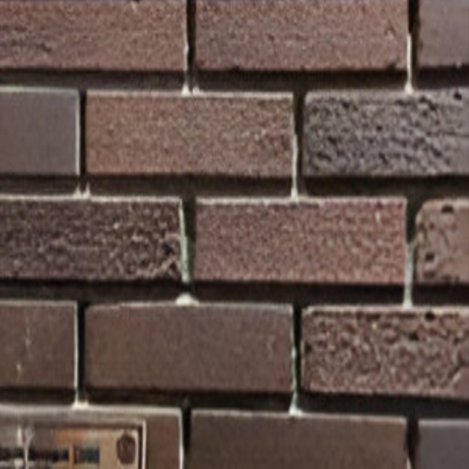Dark Brown SB Clay Brick 1.5x6 Inch, featuring deep brown tones with a textured surface, perfect for rustic walls and decorative construction accents.
