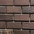 Dark Brown SB Clay Brick 1.5x6 Inch, featuring deep brown tones with a textured surface, perfect for rustic walls and decorative construction accents.
