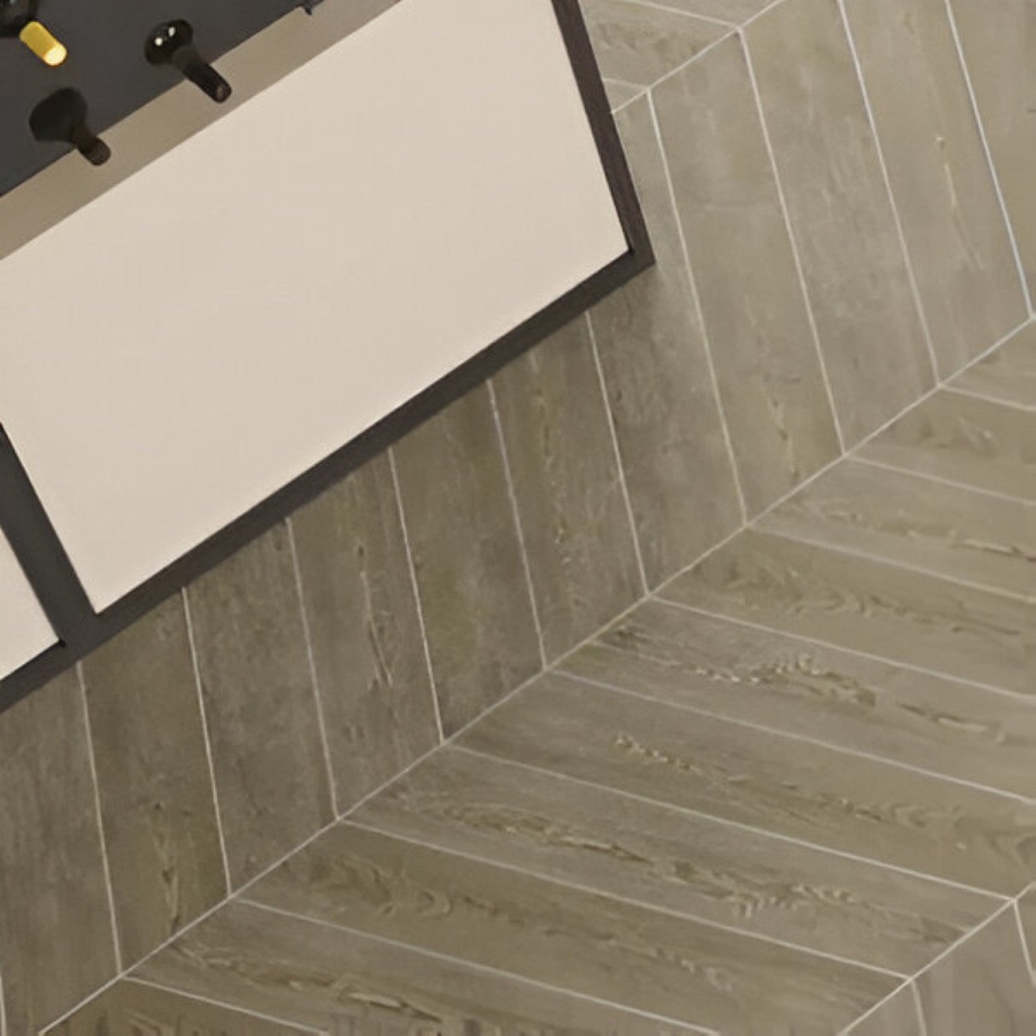 English Wood Chevron Wooden Tile 6x36 Inch, featuring natural wood tones arranged in a chevron pattern, perfect for classic and durable flooring or wall applications.
