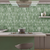 Fern Green Fluted Kitkat Tile 4x12 inch with a glossy finish, featuring a rich fern-green fluted surface, smooth and durable, ideal for contemporary backsplashes and decorative wall designs.
