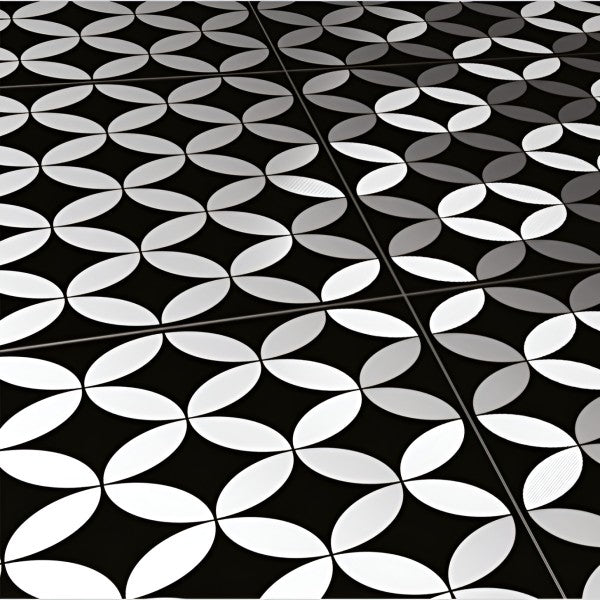 Top view of Geometrical Black Moroccan Matt 24x24 inch floor tiles arranged in a seamless pattern featuring bold black background with overlapping white petal-shaped geometric designs, giving a modern and stylish look.