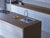 Gold Dust quartz kitchen countertop slab with polished gloss finish installed in a modern interior setting, featuring a seamless large-format quartz surface suitable for kitchen counters, dining tables, islands, and contemporary architectural spaces with elegant detailing and refined texture.