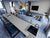 Premium quartz kitchen counter top and table top slab with elegant glossy finish installed in a modern luxury kitchen interior featuring seamless surface detailing, polished texture, spacious countertop application, and sophisticated contemporary styling suitable for residential and commercial spaces.