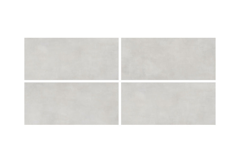 Luna Silver vitrified tile 24x48 inch installed on a modern floor showcasing a plain rustic matt and carved surface texture with large-format seamless layout