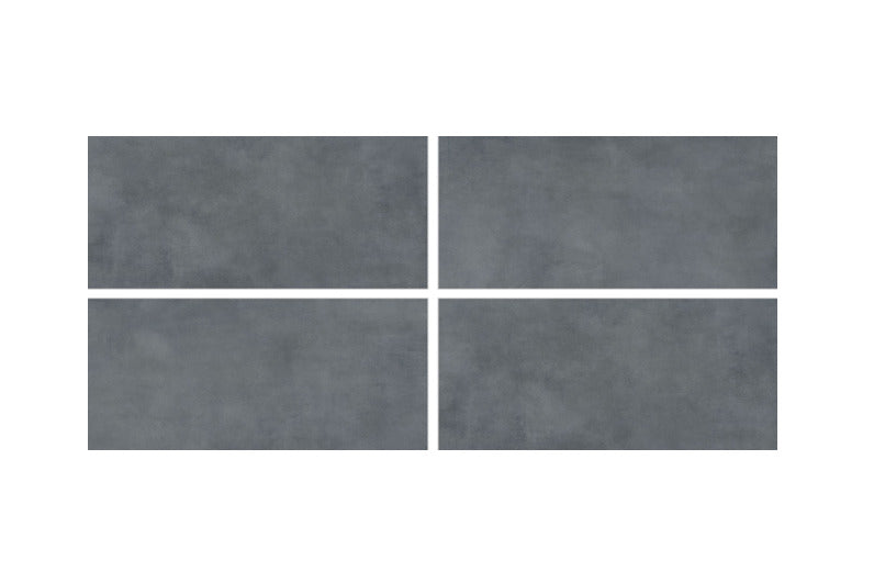 Luna Slate vitrified tile in 24x48 inch format with a plain rustic surface design, matt carving finish, and seamless large slab layout used on interior floor and wall spaces, showcasing textured detailing and modern architectural styling.