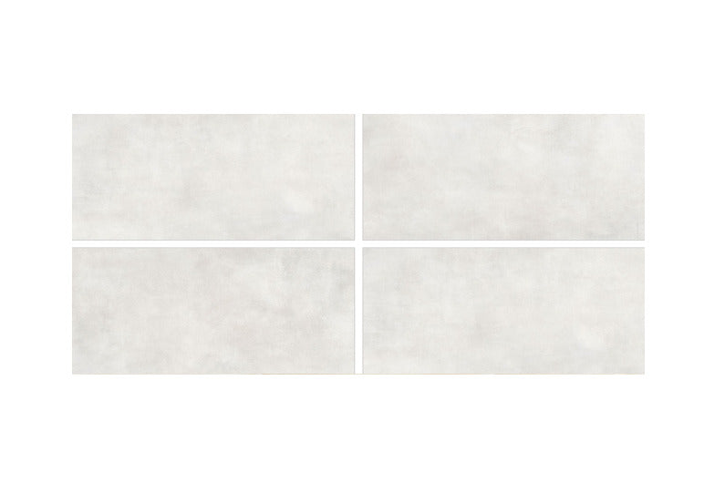 Luna Snow vitrified tile in large 24×48 inch format with plain rustic design, matt carved surface texture, suitable for modern floor and wall interior applications in residential and commercial spaces.