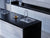 Magic Night quartz kitchen countertop slab with glossy surface finish installed in a modern kitchen interior featuring seamless countertop design, polished texture, premium quartz material, and elegant contemporary styling suitable for residential and commercial spaces.