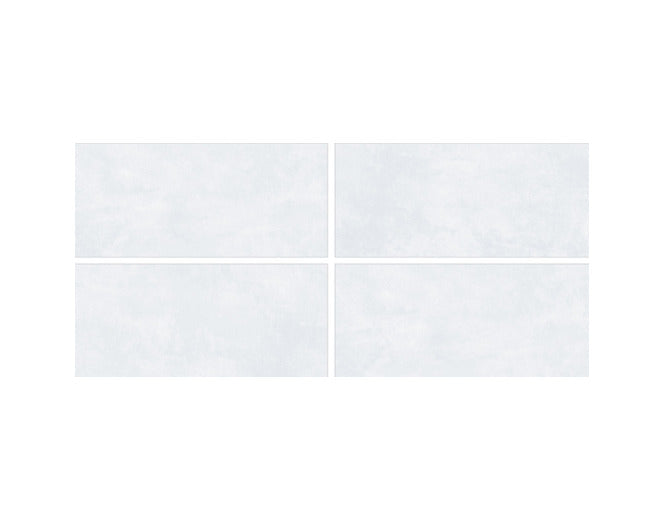 Marvel Azul vitrified tile 24×48 inch installed on a modern living room floor showing large format seamless layout with plain rustic texture, matt finish surface, and carved detailing creating a luxurious architectural appearance.