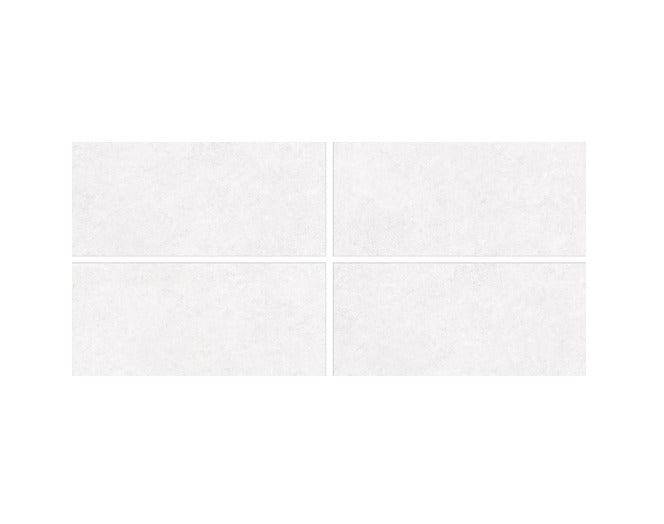 Marvel Bianco vitrified tile in 24x48 inch size showing a plain rustic surface with matt carved texture, highlighting the smooth edges, uniform pattern, and refined surface detailing suitable for modern floor and wall spaces.