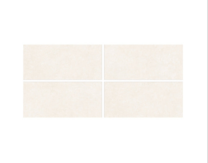 Marvel Nature vitrified tile installed on a living room floor with seamless joints, showcasing a plain rustic surface and matt carved texture that creates a natural, stone-inspired look.