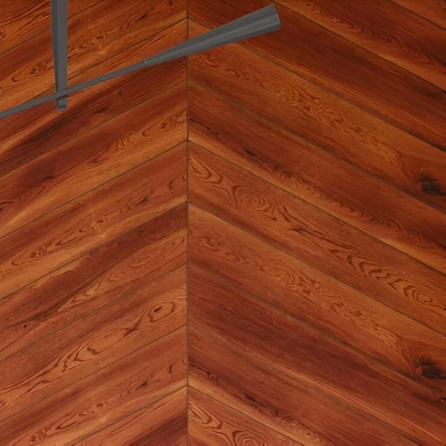 Merabu Chevron Wooden Tile 6x36 Inch, featuring rich reddish-brown Merbau wood tones arranged in a chevron pattern, perfect for elegant and durable flooring or wall applications.
