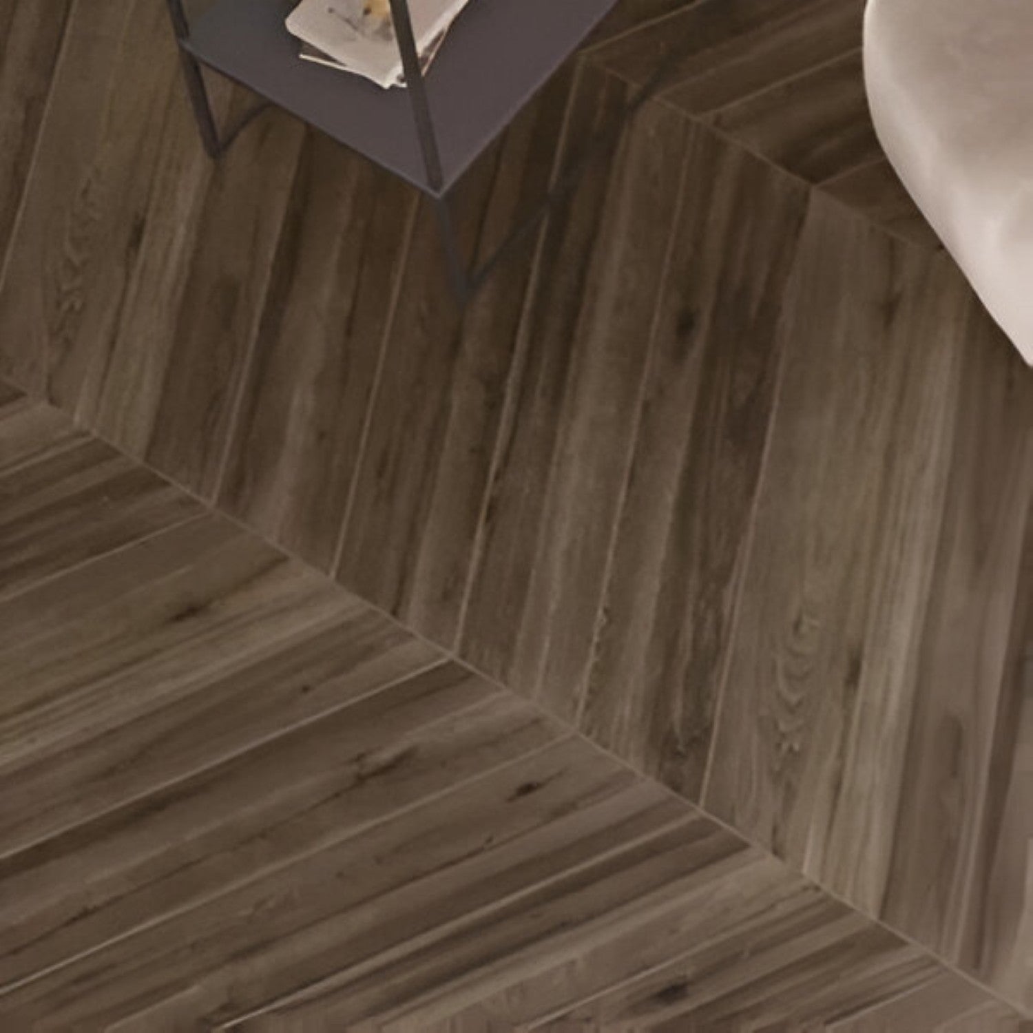 Novara Chevron Wooden Tile 6x36 Inch, featuring elegant wood tones arranged in a chevron pattern, perfect for stylish and durable flooring or wall applications.
