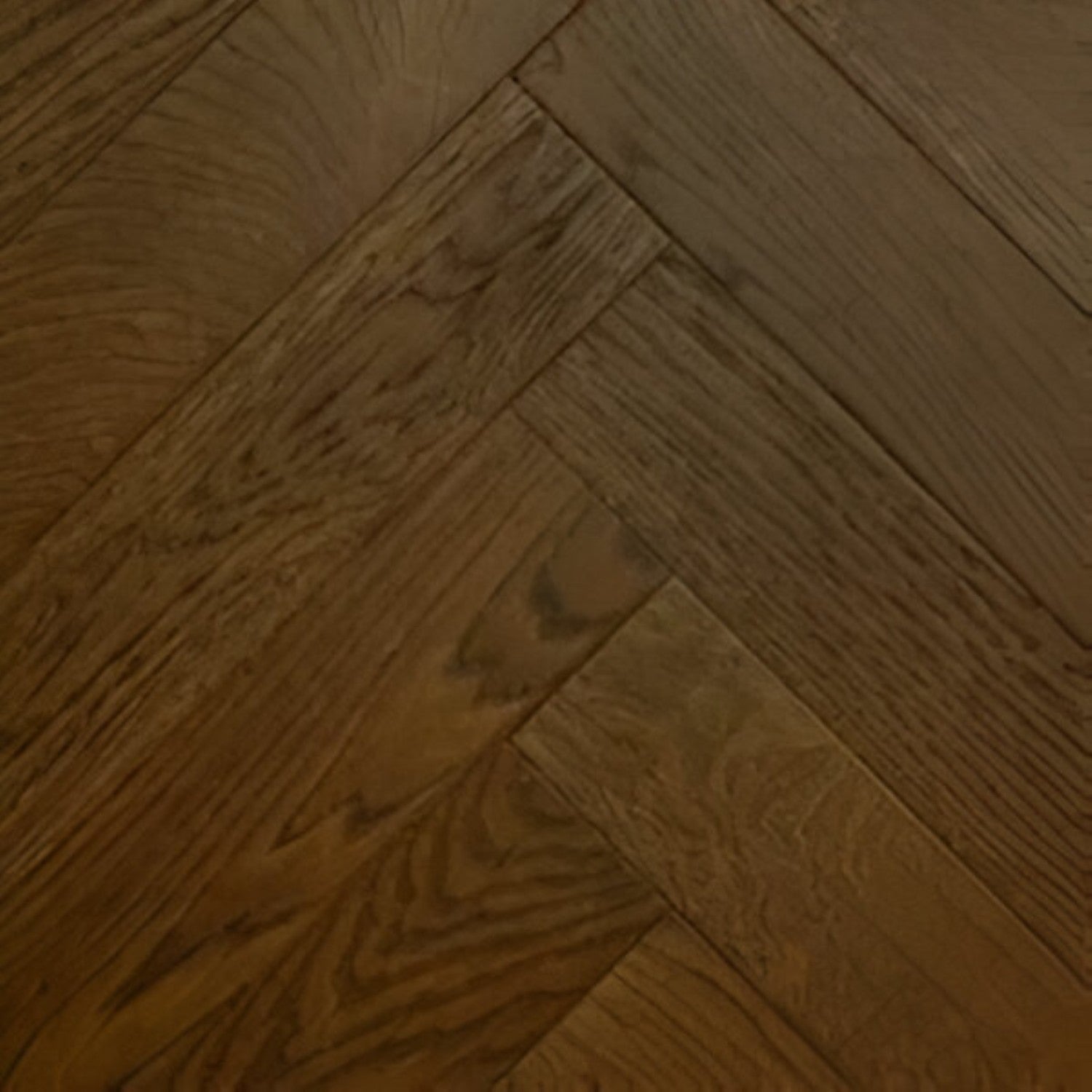 Oak Brown Herringbone Flooring 4x28 inch with warm brown oak finish, durable solid wood surface, featuring stylish herringbone pattern, perfect for contemporary interiors, living spaces, and premium commercial flooring applications
