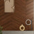 Oak Walnut Chevron Wooden Tile 6x36 Inch, featuring rich walnut oak tones arranged in a chevron pattern, perfect for elegant and durable flooring or wall applications.
