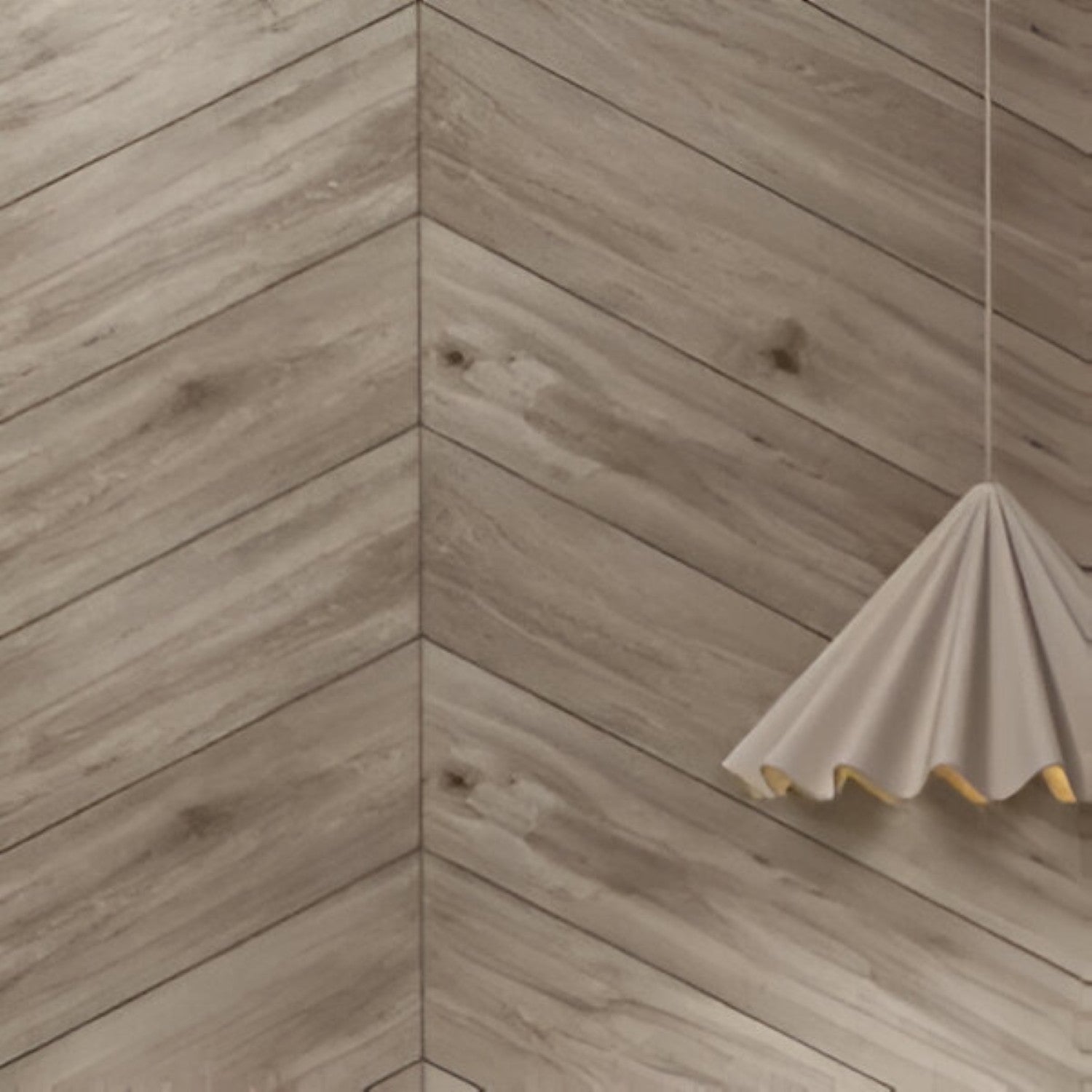 Oaklore Grigio Chevron Wooden Tile 6x36 Inch, featuring soft grey oak tones arranged in a chevron pattern, ideal for contemporary and durable flooring or wall applications.

