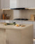 Premium quartz kitchen counter top slab with glossy polished finish installed in a modern kitchen interior featuring a seamless surface design suitable for luxury kitchen counters, dining table tops, island counters, and contemporary commercial spaces.