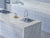 Premium Classic Calacatta quartz kitchen countertop slab with polished gloss finish installed in a modern kitchen interior featuring a seamless engineered stone surface suitable for kitchen counters, islands, and luxury table top applications.