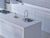 Premium Ice Storm quartz kitchen countertop slab with polished gloss finish installed in a modern modular kitchen interior, featuring a smooth engineered quartz surface suitable for countertops, islands, dining tabletops, and contemporary residential or commercial spaces.