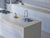 Premium Natura Beige quartz kitchen counter top slab with glossy finish installed in a contemporary modular kitchen interior featuring a smooth polished surface, seamless countertop edges, spacious workspace appearance, and elegant engineered quartz texture suitable for luxury residential and commercial spaces.