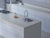 Premium Natura White quartz kitchen countertop slab with polished gloss finish installed in a modern kitchen interior, showcasing seamless engineered quartz surface suitable for kitchen counters, islands, dining table tops, and luxury contemporary spaces with durable and elegant construction.