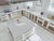 Premium quartz kitchen counter top slab with polished gloss finish installed in a modern modular kitchen interior, featuring a smooth engineered stone surface designed for luxurious kitchen counters, islands, dining table tops, and contemporary interior applications with seamless large-format slab detailing.