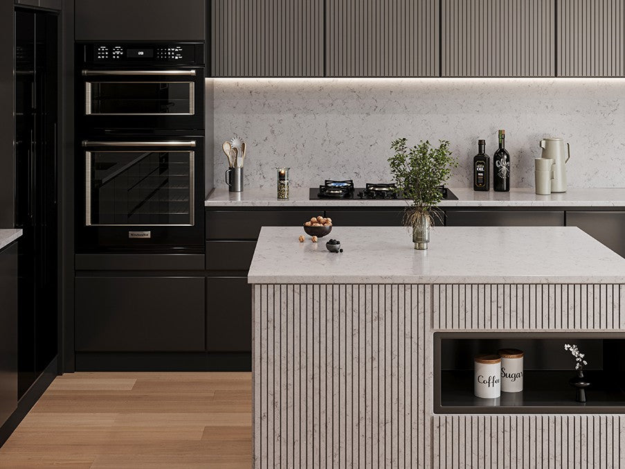 Premium quartz kitchen countertop slab with polished glossy surface installed in a modern modular kitchen setting featuring seamless edge detailing, spacious counter layout, refined engineered stone texture, and elegant contemporary interior styling suitable for residential and commercial spaces.