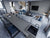 Premium engineered quartz kitchen countertop slab with glossy polished surface installed in a modern kitchen interior featuring seamless edges, durable construction, luxurious finish, spacious countertop design, and elegant contemporary styling suitable for residential and commercial spaces.