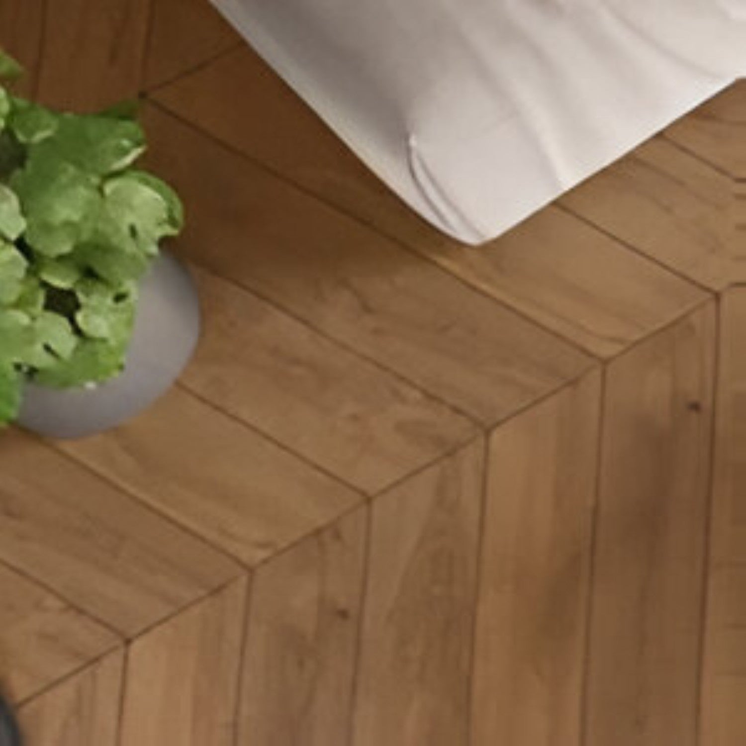 Puritan Pine Chevron Wooden Tile 6x36 Inch, featuring medium pine wood tones arranged in a chevron pattern, perfect for rustic and durable flooring or wall applications.
