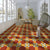 Royal Octagon Ceramic Athangudi Tile 12 Inch x 12 Inch in vibrant yellow and red color featuring traditional Athangudi, Moroccan, and Rangoli-inspired geometric printed patterns with a premium matt finish, installed on both wall and floor in an elegant Indian-style living space, suitable for bathrooms, kitchens, balconies, bedrooms, and living rooms, showcasing durable ceramic construction and timeless decorative appeal.
