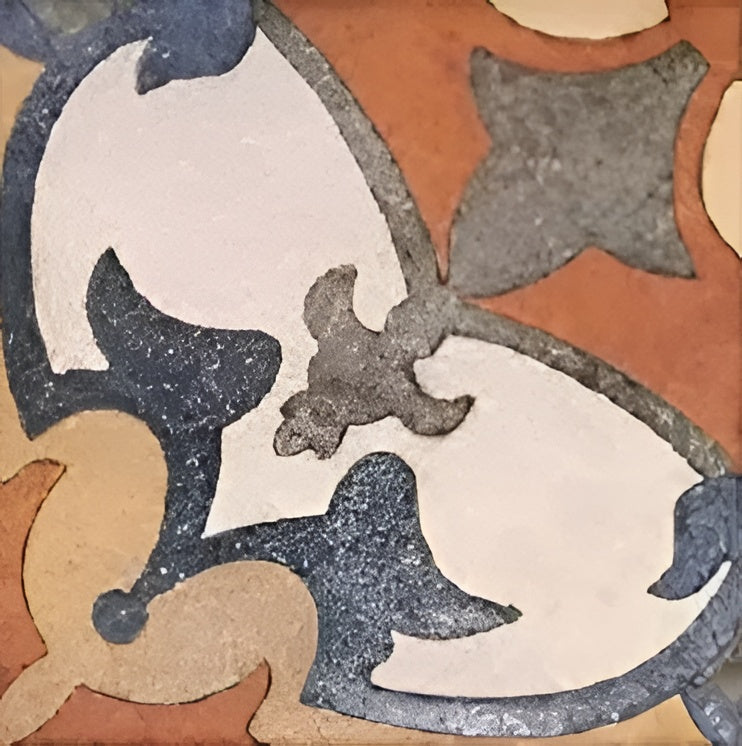 Colorful Savoca Decor 6x6 inch ceramic tiles arranged in a vintage patchwork style on a kitchen backsplash, featuring a mix of floral, geometric, and traditional patterns in warm earthy tones of terracotta, blue, mustard, and grey.