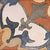 Colorful Savoca Decor 6x6 inch ceramic tiles arranged in a vintage patchwork style on a kitchen backsplash, featuring a mix of floral, geometric, and traditional patterns in warm earthy tones of terracotta, blue, mustard, and grey.