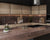 Sawai Emperador quartz kitchen countertop slab with polished gloss finish installed in a modern kitchen and table top setting, showcasing a premium engineered quartz surface with elegant texture, seamless appearance, large slab dimensions, and luxurious contemporary interior styling suitable for residential and commercial spaces.