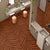 Sedona Chevron Wooden Tile 6x36 Inch, featuring rich reddish-brown wood tones arranged in a chevron pattern, perfect for elegant and durable flooring or wall applications.
