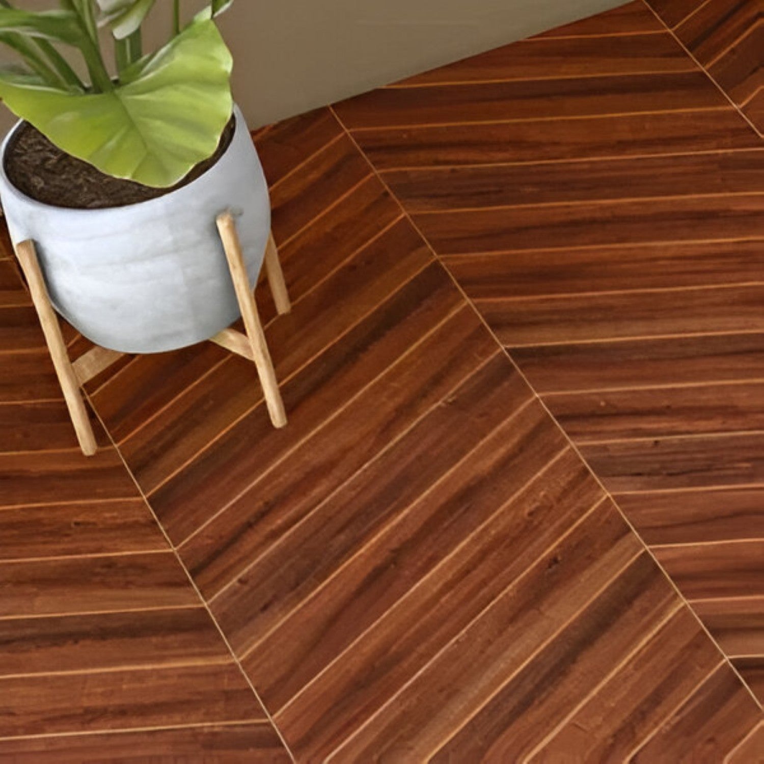 Sedona Chevron Wooden Tile 6x36 Inch, featuring rich reddish-brown wood tones arranged in a chevron pattern, perfect for elegant and durable flooring or wall applications.
