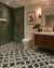 Shein Moroccan Vitrified Tile 16x16 Inch (B) featuring intricate Moroccan-inspired printed patterns with decorative Rangoli-style motifs, matt finish surface, premium vitrified construction, and artistic geometric detailing designed for elegant bathroom floor applications in residential interiors.