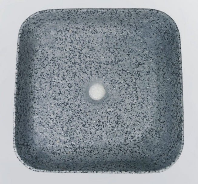 Square ceramic countertop washbasin with terrazzo surface design, featuring a smooth glazed finish, structured edges, and a compact 400 × 400 × 135 mm form, placed on a modern vanity counter with a contemporary faucet, showcasing a premium bathroom interior style.