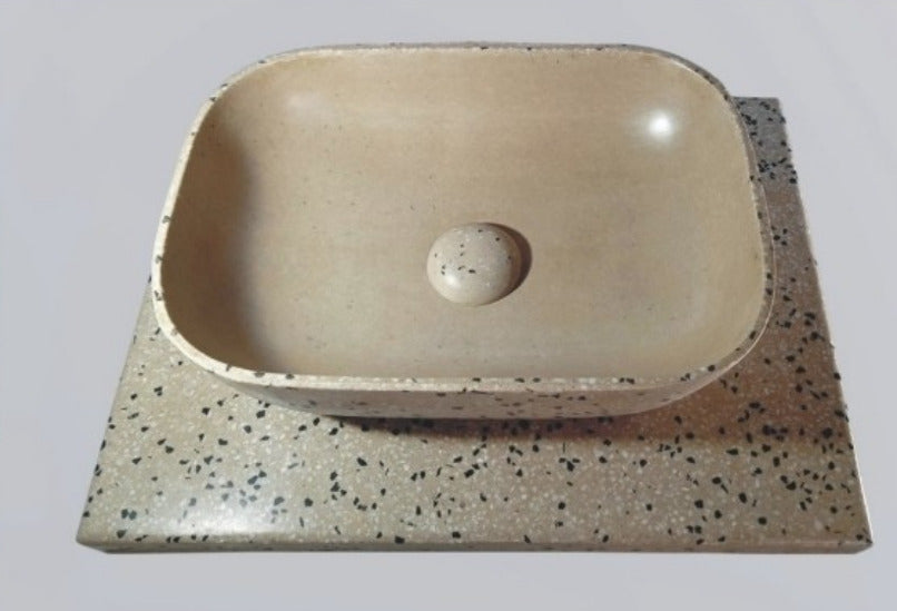 TTH-028 terrazzo design ceramic countertop washbasin placed on a modern vanity counter, featuring a smooth curved bowl structure, refined terrazzo surface pattern, ergonomic depth, clean edges, and premium ceramic finish suitable for contemporary bathroom interiors.