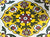 TTH-362 Ceramic Tile 3 x 6 Inch – Handmade ceramic tile featuring an intricate traditional floral pattern with a yellow base and maroon, green, and white accents, bordered in brown.