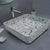 Ceramic countertop washbasin TTH 032 featuring a terrazzo-inspired surface pattern, square countertop design with smooth edges, compact 356x356x130 mm dimensions, premium ceramic construction suitable for modern residential and commercial bathroom interiors