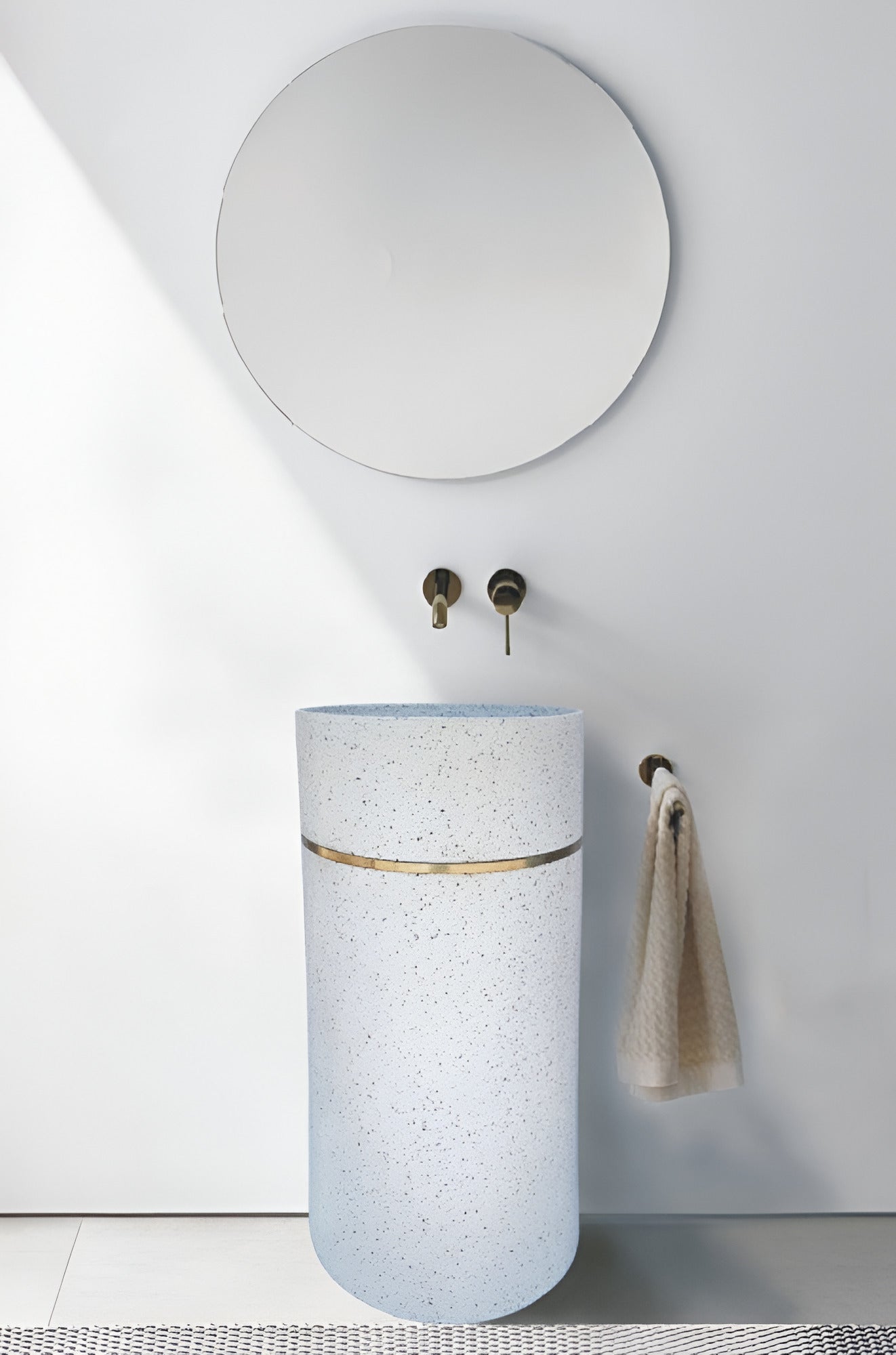 A ceramic pedestal washbasin TTH 117 featuring a smoothly contoured basin mounted on a stable pedestal base, displaying its 410×410×850mm proportions, gently curved edges, and a well-structured bowl depth suitable for everyday handwashing in residential and commercial bathrooms.
