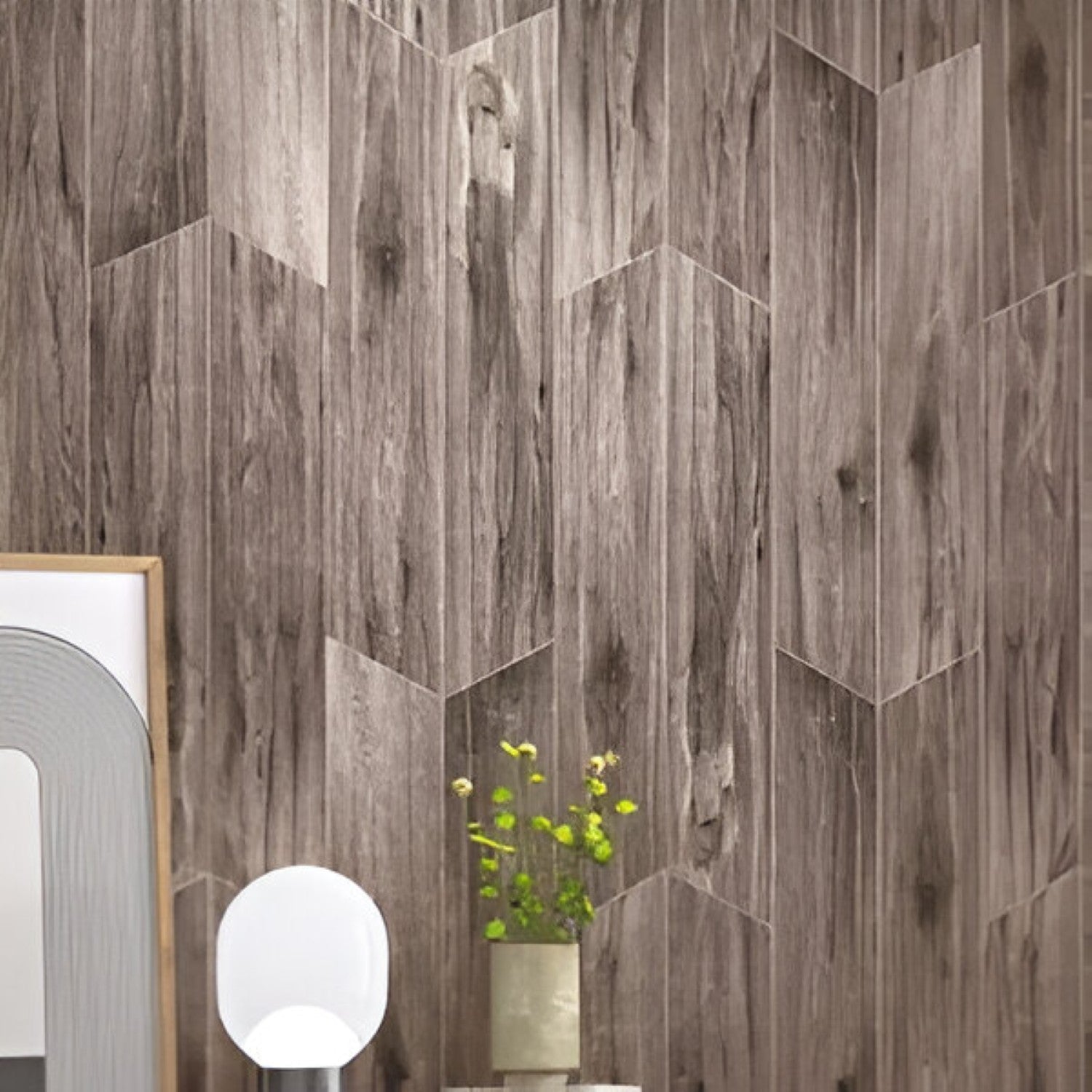 Twilight Chevron Wooden Tile 6x36 Inch, featuring deep, muted wood tones arranged in a chevron pattern, ideal for modern and durable flooring or wall applications.
